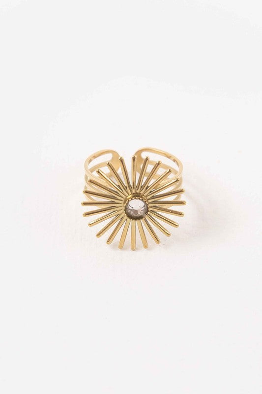 Stunning gold sunburst ring with a diamond at the center, on a triple-layered band, adjustable from sizes 6 to 9.