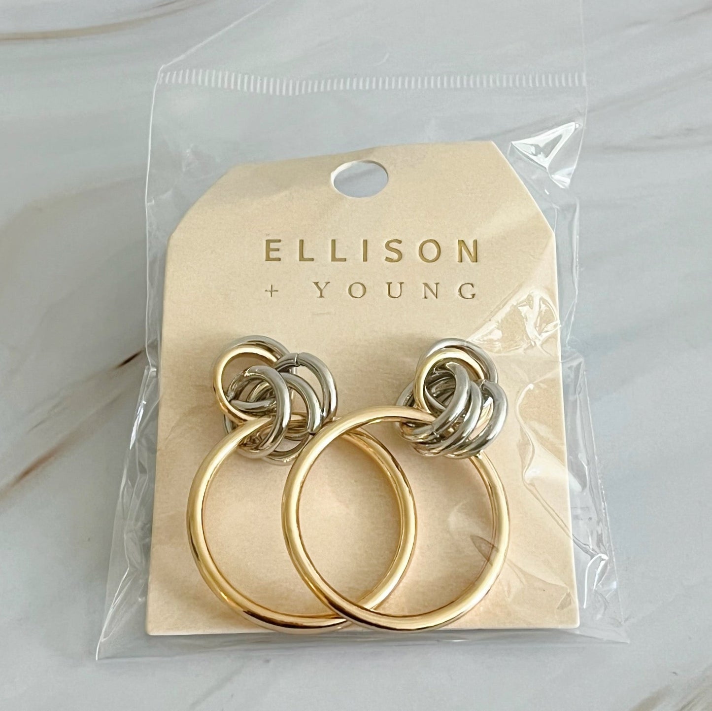 Unique gold and silver hoop earrings, 1.2" x 1.4", ideal statement piece to add elegance and turn heads.