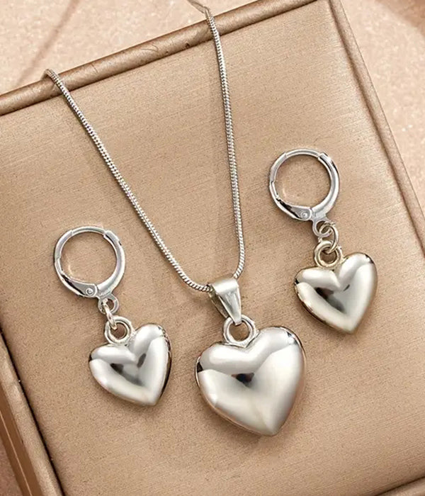 Silver heart-shaped pendant and earrings set, featuring a puffy design; pendant size 0.68 x 0.98 inches, necklace length 17.32 inches