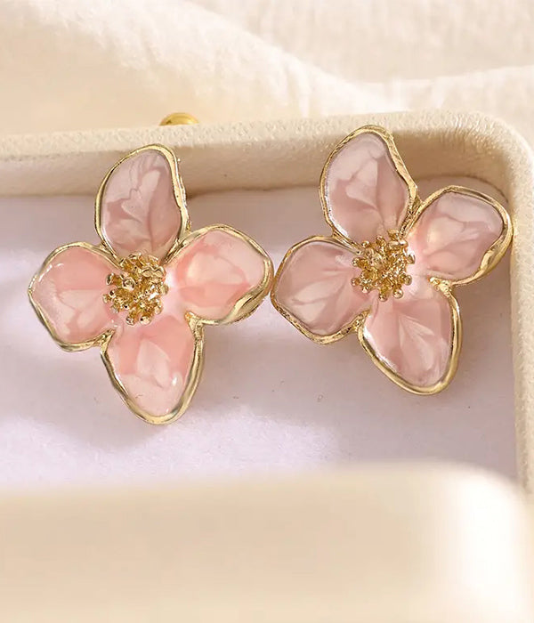 Pink epoxy flower earrings displayed in a box, measuring 0.86 x 0.98 inches