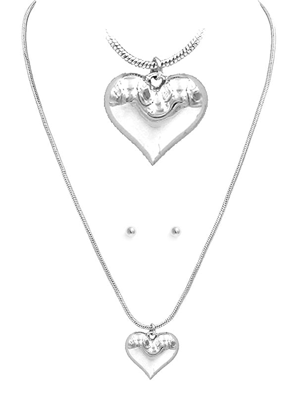 Heart-shaped necklace and earrings set featuring a puffy pendant, silver color, with a 17-inch adjustable chain