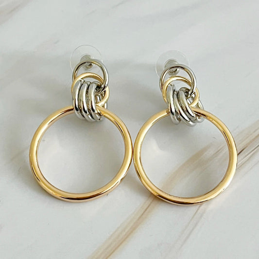 Two-tone gold and silver hoop earrings, 1.2" x 1.4", crafted from plated alloy metal, stylish and elegant for any occasion.