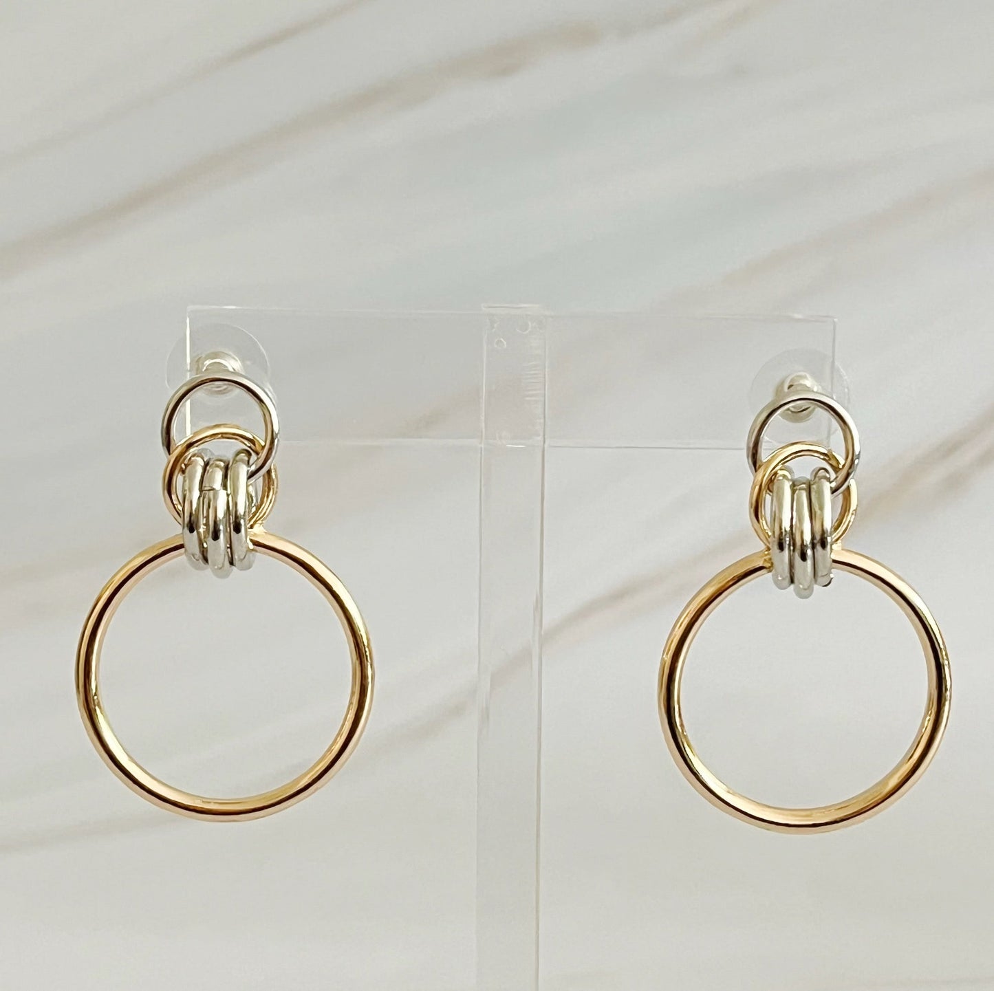 Unique two-tone gold and silver hoop earrings, 1.2" x 1.4",
crafted from plated alloy, ideal statement piece for any event.