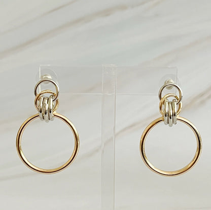 Unique two-tone gold and silver hoop earrings, 1.2" x 1.4",
crafted from plated alloy, ideal statement piece for any event.