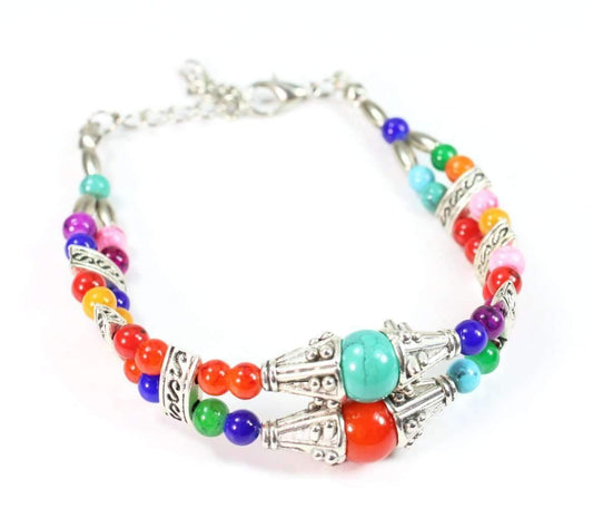 Colorful bracelet featuring multicolored marbled beads and silver charms, perfect for spring and summer outfits.
