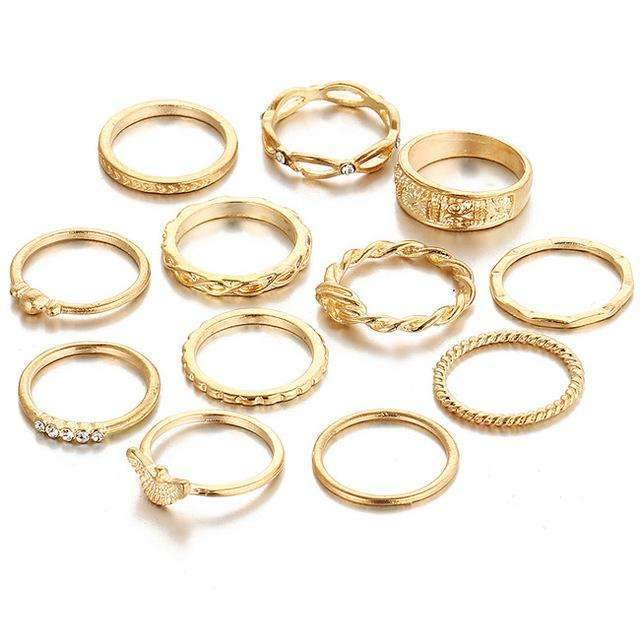 Set of 12 gold plated rings in different sizes, crafted from zinc alloy and gemstones. Sizes are fixed as shown in the image.