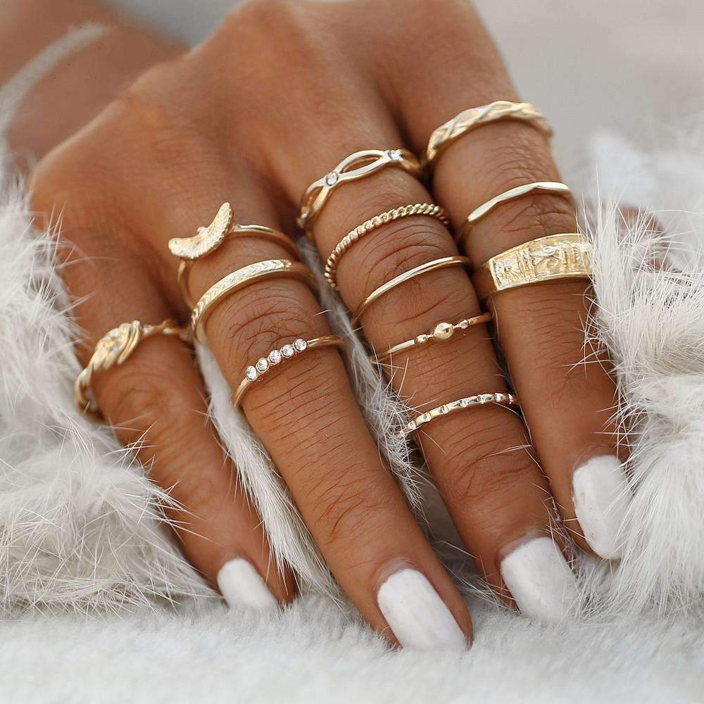 A woman's hand adorned with multiple rings , showcasing a stylish collection of fixed-size jewelry