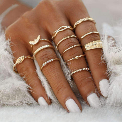 A woman's hand adorned with multiple rings , showcasing a stylish collection of fixed-size jewelry