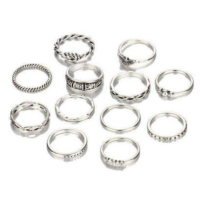 A set of 12 silver rings featuring various designs, made of zinc alloy and gemstones, with fixed sizes shown in the image.