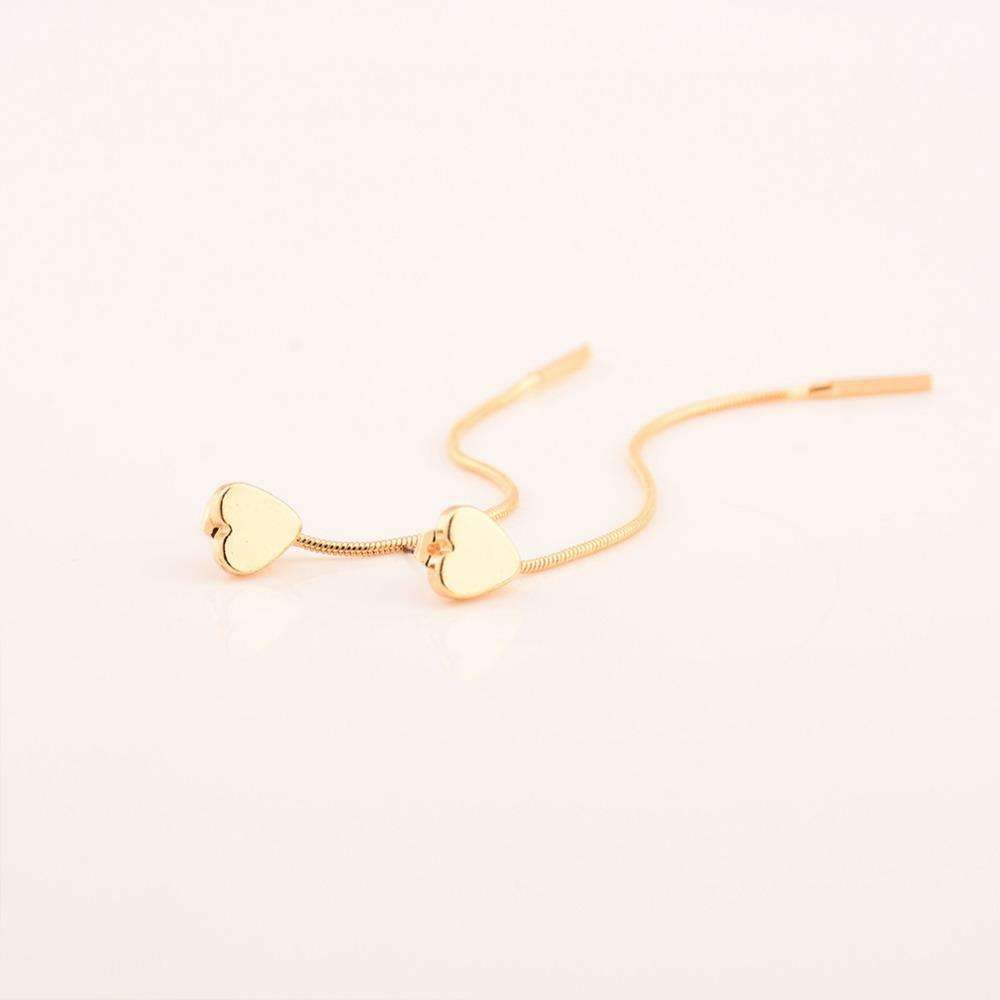 Two gold heart-shaped drop earrings, 8 cm long, displayed on a white surface. Made of alloy material