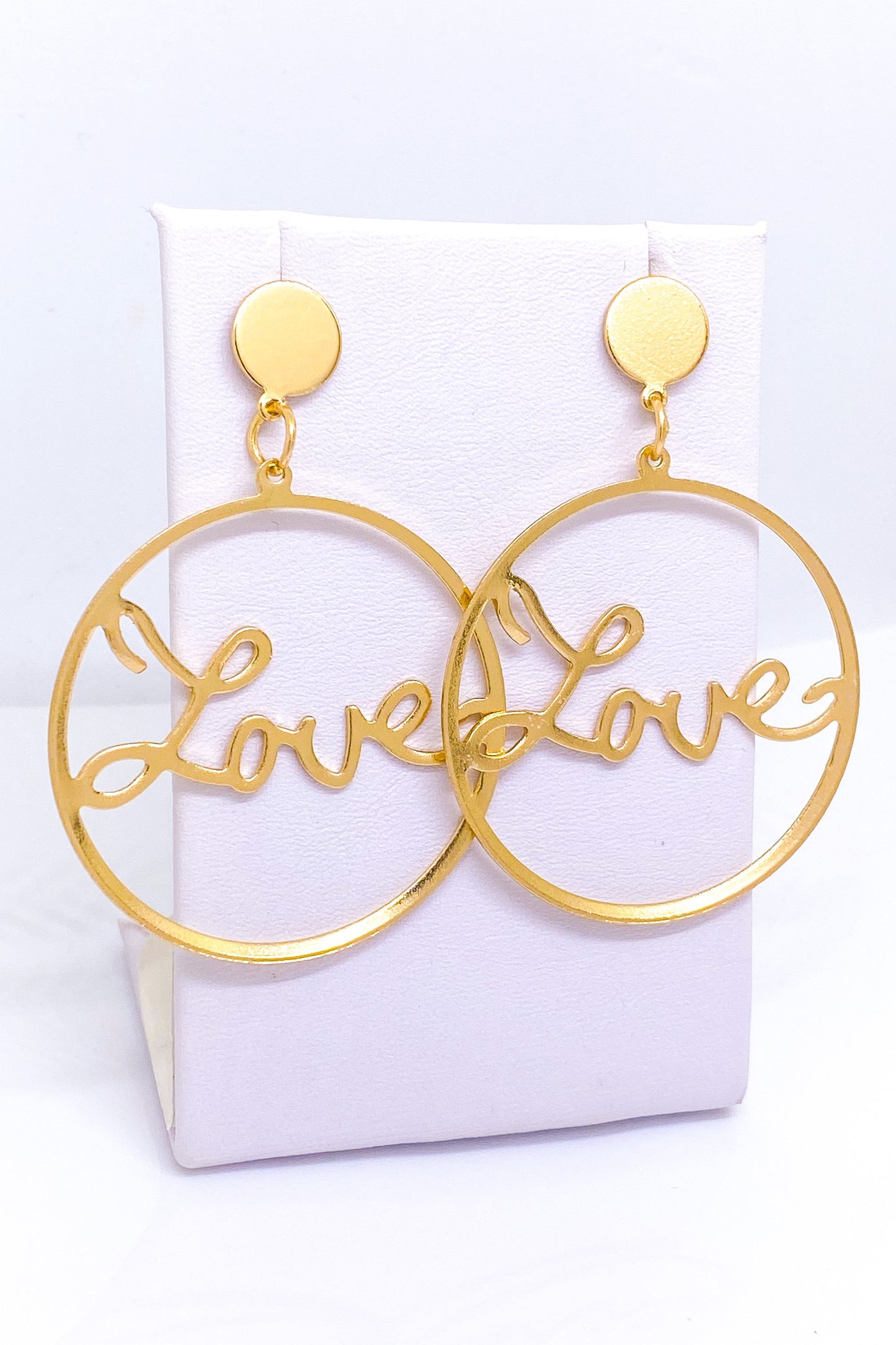 Elegant gold love hoop earrings in a geometric design, crafted from durable zinc alloy for lasting shine and style.