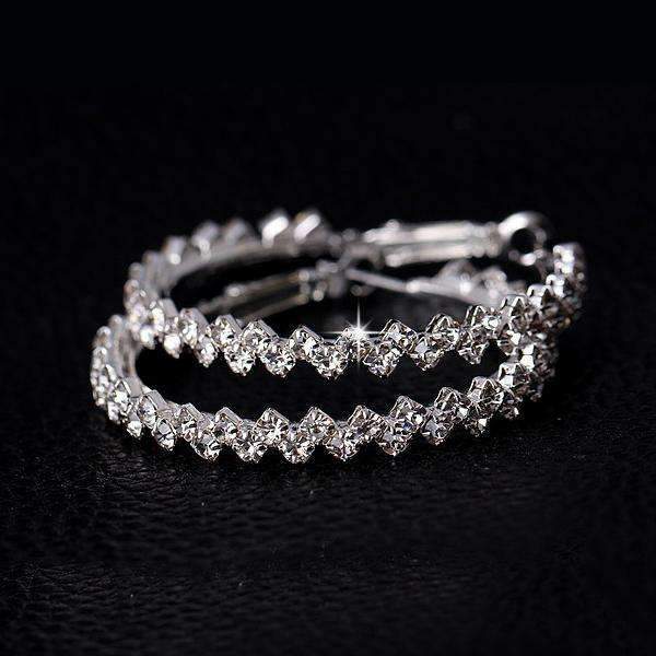 Elegant diamond hoop earrings with a zig-zag pattern, crafted from Austrian crystal and zinc alloy, available in two sizes.