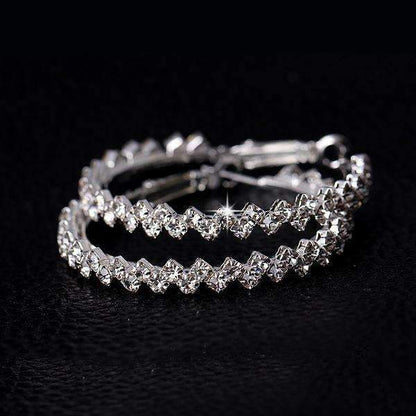 Elegant diamond hoop earrings with a zig-zag pattern, crafted from Austrian crystal and zinc alloy, available in two sizes.