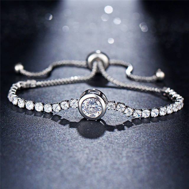 A diamond bracelet featuring a silver chain, adjustable length, made of zinc alloy, available in rose gold and silver. ÷
