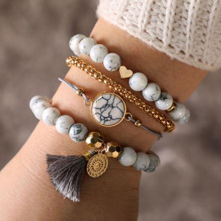 White marble bracelet set with gold tassel, featuring four high-quality zinc alloy bracelets with elegant marble and gold elements.
