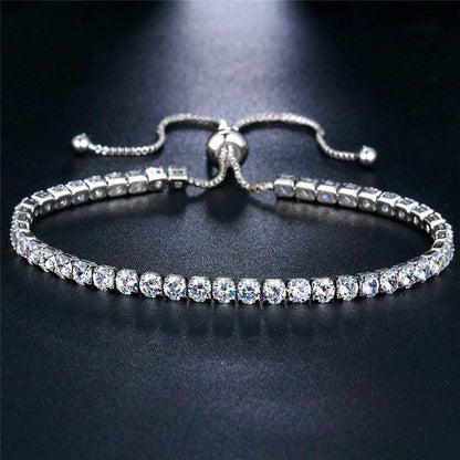 Silver adjustable bracelet adorned with clear crystals, crafted from high-quality zinc alloy and cubic zirconia.