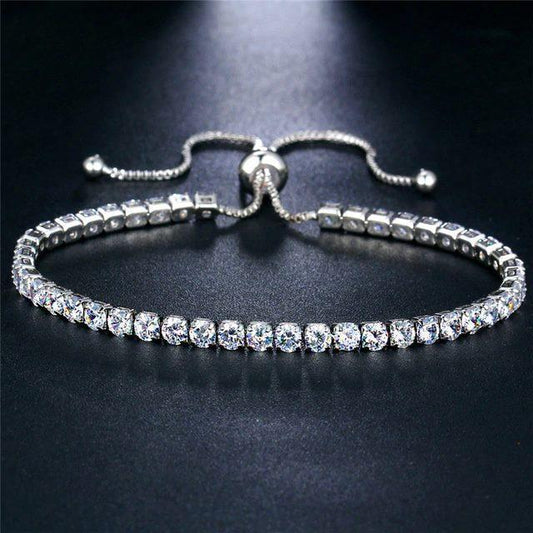 Silver adjustable bracelet adorned with clear crystals, crafted from high-quality zinc alloy and cubic zirconia.