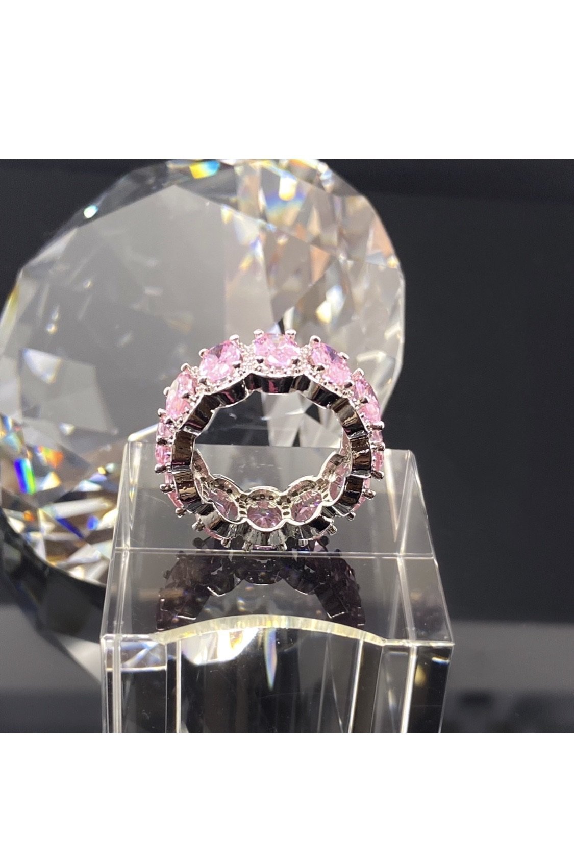 A stackable pink diamond ring with a pink stone, crafted in
polished 14K white gold, embodying a statement of luxury.
