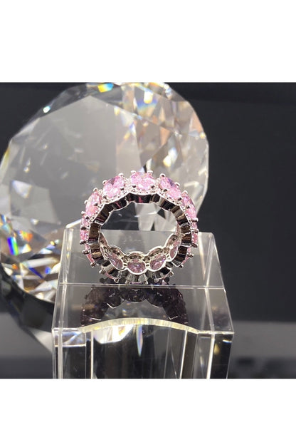 A stackable pink diamond ring with a pink stone, crafted in
polished 14K white gold, embodying a statement of luxury.
