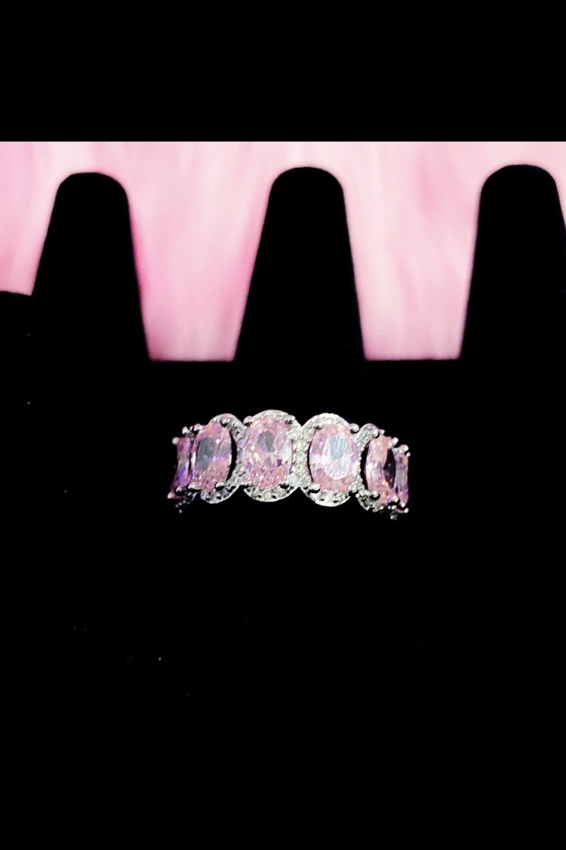 A pink diamond ring featuring a pink stone, set in high polished
14K white gold, showcasing elegance and extravagance.
