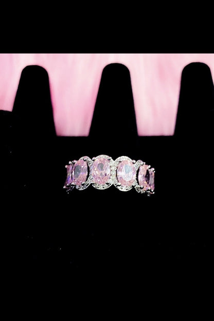 A pink diamond ring featuring a pink stone, set in high polished
14K white gold, showcasing elegance and extravagance.
