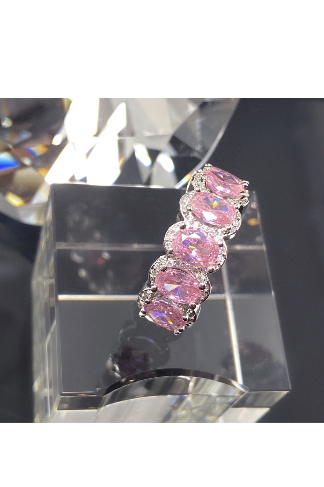 A stackable pink diamond ring with a pink stone, crafted in
polished 14K white gold, embodying a statement of luxury.
