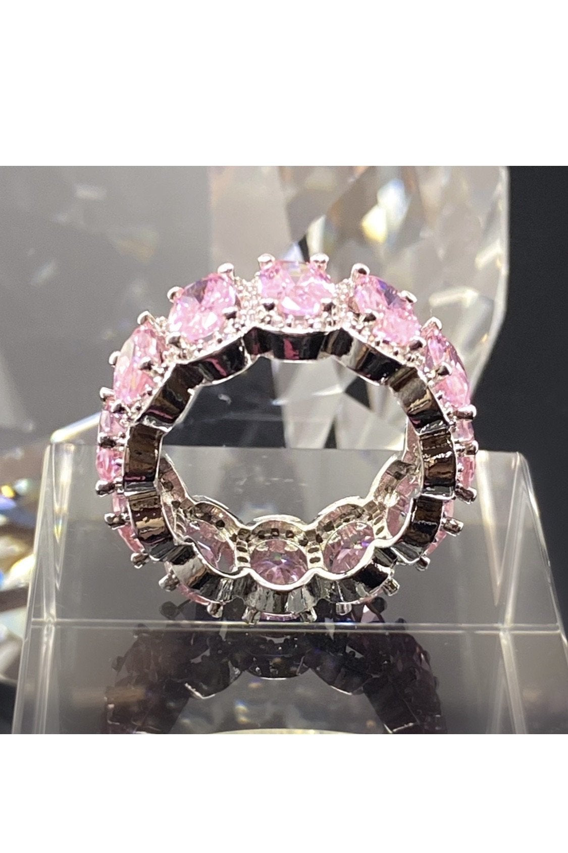 Pink diamond eternity band in high polished 14K white gold, featuring flawless VVS simulants for a luxurious look.