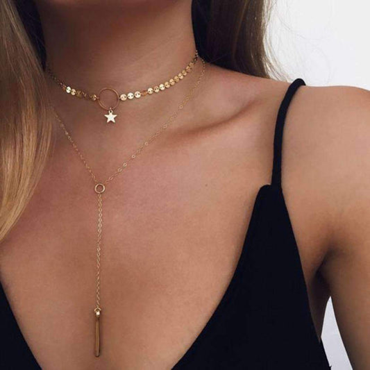 Elegant two-layer gold necklace featuring a star choker and long lariat, adjustable for a perfect fit and added sparkle